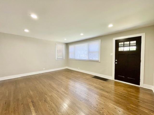10049 S Calhoun Ave, Chicago, IL 60617 - entryway featuring plenty of natural light, dark wood finished floors, and recessed lighting