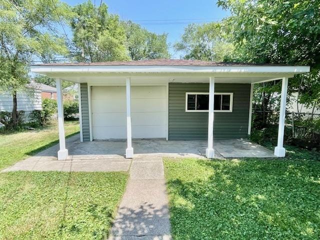 10049 S Calhoun Ave, Chicago, IL 60617 - view of outdoor structure with a garage and driveway