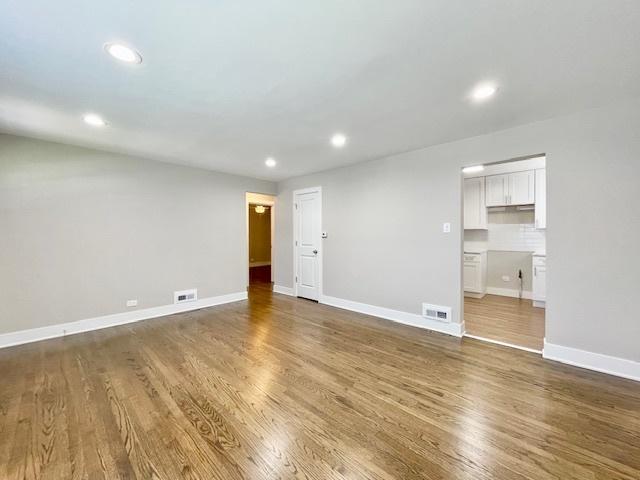 10049 S Calhoun Ave, Chicago, IL 60617 - spare room featuring wood finished floors and recessed lighting