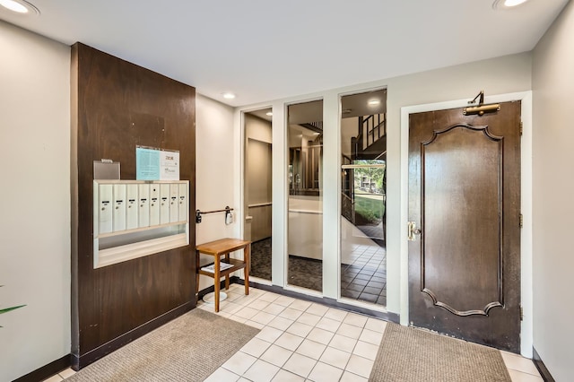 455 Raintree Ct Unit 1C, Glen Ellyn, IL 60137 - foyer with light tile patterned floors and recessed lighting
