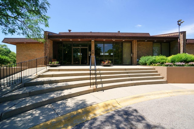 455 Raintree Ct Unit 1C, Glen Ellyn, IL 60137 - entrance to property featuring brick siding and a patio area