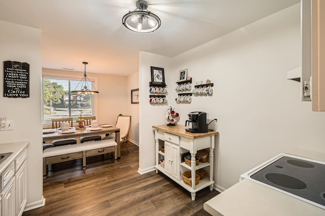 455 Raintree Ct Unit 1C, Glen Ellyn, IL 60137 - kitchen with dark wood finished floors, white cabinets, light countertops, open shelves, and a chandelier