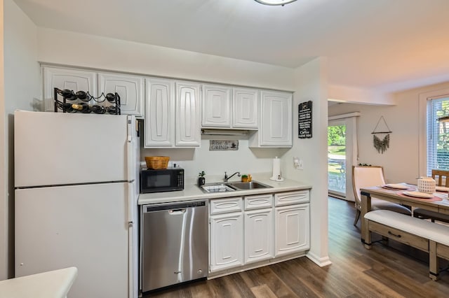455 Raintree Ct Unit 1C, Glen Ellyn, IL 60137 - kitchen with freestanding refrigerator, stainless steel dishwasher, black microwave, light countertops, and dark wood-style floors