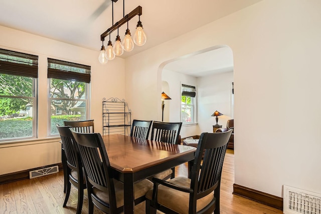 4017 Park Ave, Brookfield, IL 60513 - dining area featuring arched walkways and wood finished floors