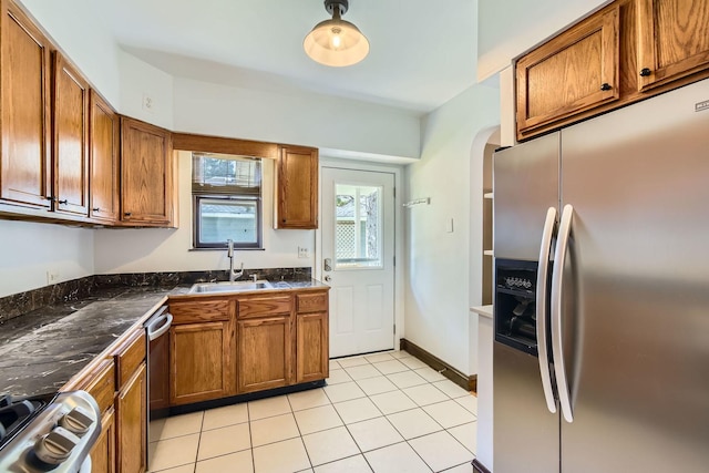 4017 Park Ave, Brookfield, IL 60513 - kitchen with appliances with stainless steel finishes, dark countertops, brown cabinets, and light tile patterned flooring