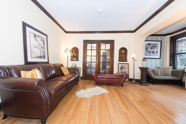 508 Madison St Unit 2S, Oak Park, IL 60302 - living room featuring light wood-style floors, crown molding, and arched walkways