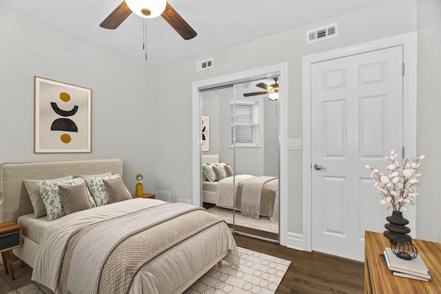 5656 N Kimball Ave Unit Gs, Chicago, IL 60659 - bedroom with dark wood-style flooring, a closet, and ceiling fan