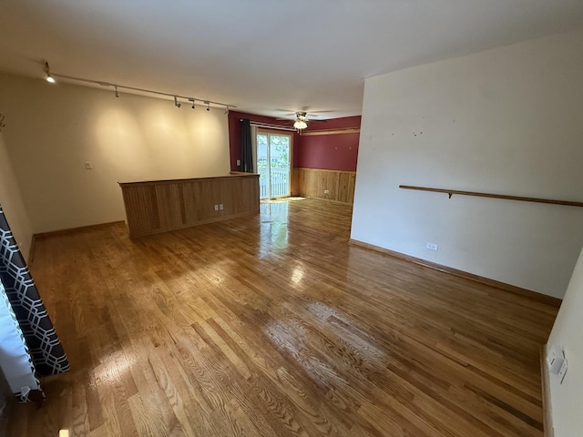 1690 Ashburn Ct Unit A, Wheaton, IL 60189 - unfurnished room featuring rail lighting, wood finished floors, a ceiling fan, and wainscoting