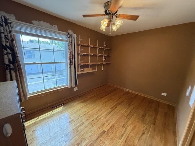 1690 Ashburn Ct Unit A, Wheaton, IL 60189 - empty room featuring wood finished floors and ceiling fan