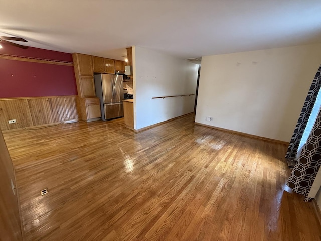 1690 Ashburn Ct Unit A, Wheaton, IL 60189 - unfurnished living room with wood finished floors, ceiling fan, and a wainscoted wall