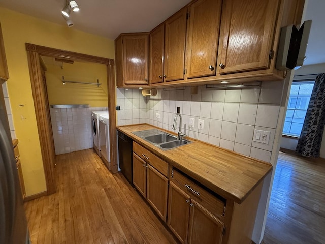 1690 Ashburn Ct Unit A, Wheaton, IL 60189 - kitchen featuring independent washer and dryer, dishwasher, light wood finished floors, brown cabinets, and wooden counters