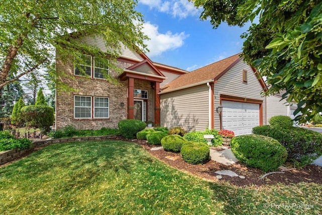 2370 Nantucket Ln, Elgin, IL 60123 - traditional-style house featuring a garage, a front yard, and brick siding