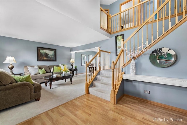 2370 Nantucket Ln, Elgin, IL 60123 - living area with wood finished floors, stairway, and a towering ceiling
