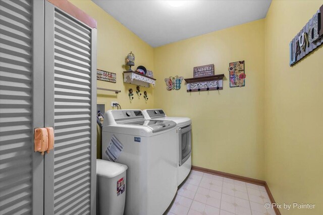 2370 Nantucket Ln, Elgin, IL 60123 - laundry room featuring washing machine and clothes dryer and light tile patterned floors