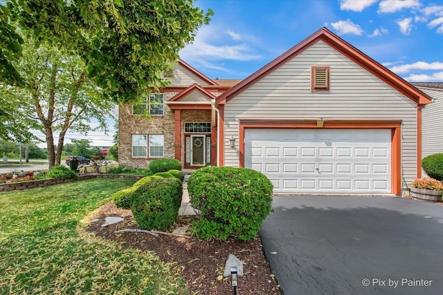 2370 Nantucket Ln, Elgin, IL 60123 - view of front of property with asphalt driveway, a garage, and a front lawn