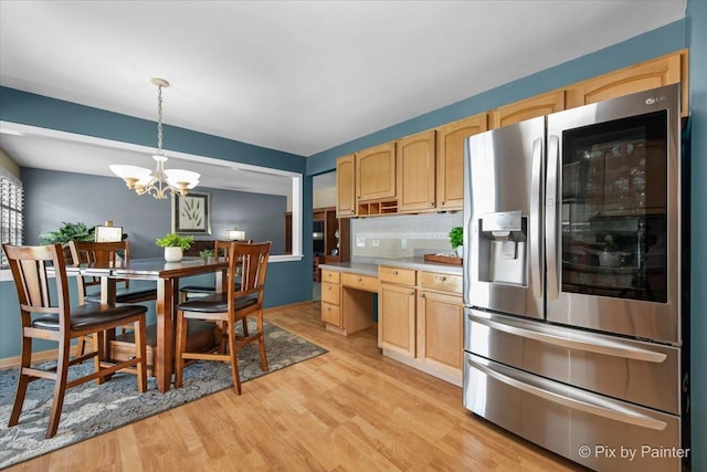 2370 Nantucket Ln, Elgin, IL 60123 - kitchen with stainless steel fridge, light wood-style flooring, light brown cabinetry, and pendant lighting