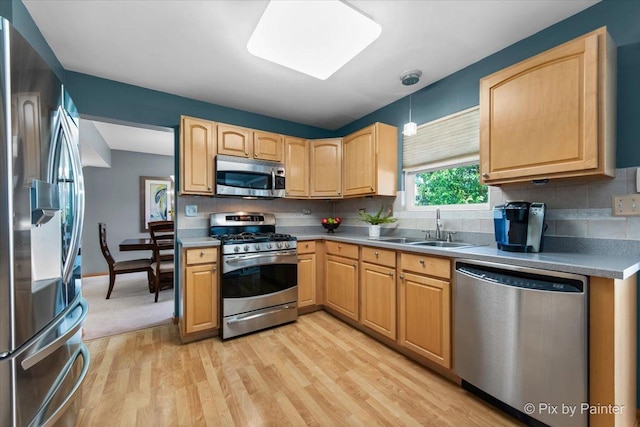 2370 Nantucket Ln, Elgin, IL 60123 - kitchen featuring stainless steel appliances, light wood finished floors, tasteful backsplash, light brown cabinets, and light countertops