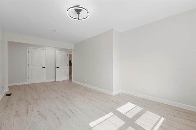 7111 S Michigan Ave, Chicago, IL 60619 - unfurnished bedroom featuring light wood-style flooring and baseboards