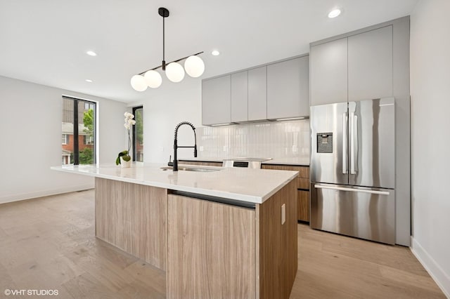 220 S Oakley Blvd, Chicago, IL 60612 - kitchen featuring stainless steel refrigerator with ice dispenser, modern cabinets, light wood-style floors, and recessed lighting