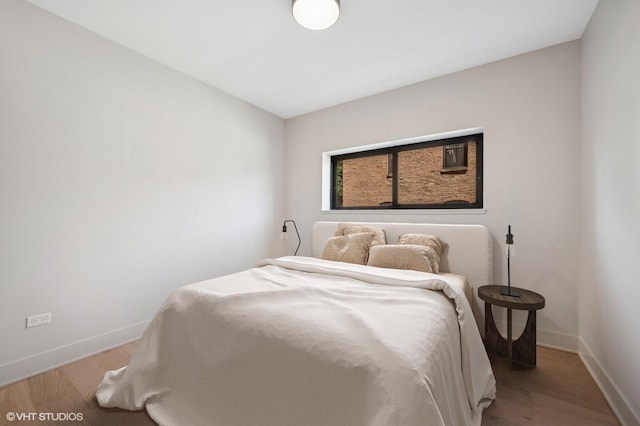 220 S Oakley Blvd, Chicago, IL 60612 - bedroom featuring baseboards and wood finished floors