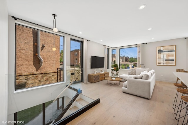 220 S Oakley Blvd, Chicago, IL 60612 - living area with plenty of natural light, light wood-style floors, and recessed lighting