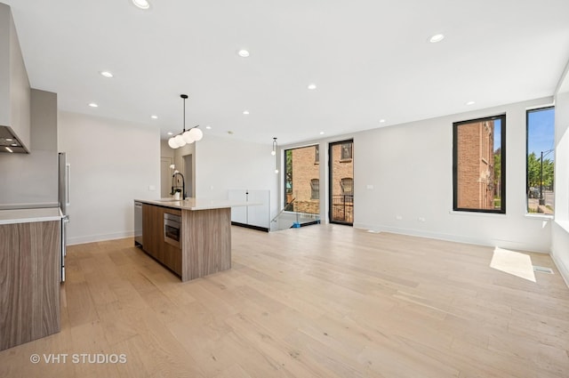 220 S Oakley Blvd, Chicago, IL 60612 - kitchen with modern cabinets, plenty of natural light, light countertops, appliances with stainless steel finishes, and recessed lighting
