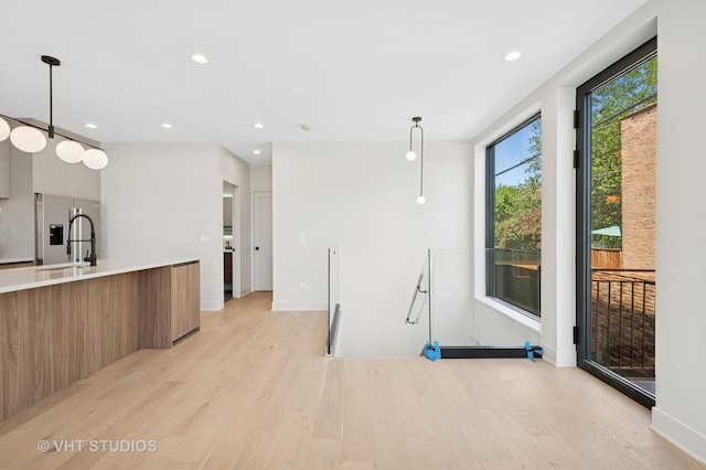 220 S Oakley Blvd, Chicago, IL 60612 - kitchen with modern cabinets, light wood-style flooring, stainless steel refrigerator with ice dispenser, light countertops, and recessed lighting