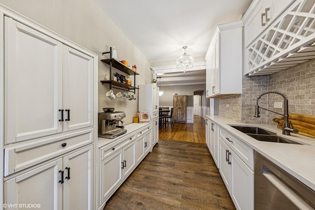 427 S Taylor Ave Unit 2N, Oak Park, IL 60304 - kitchen with white cabinets, backsplash, dark wood finished floors, and light countertops