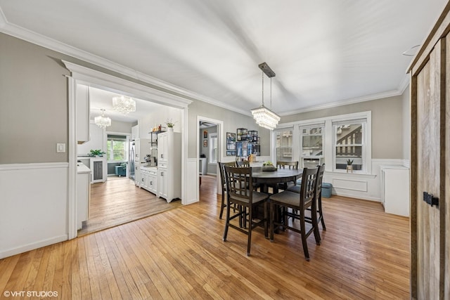 427 S Taylor Ave Unit 2N, Oak Park, IL 60304 - dining space with a chandelier, light wood-style flooring, ornamental molding, and wainscoting