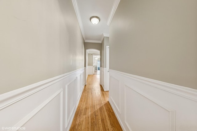 427 S Taylor Ave Unit 2N, Oak Park, IL 60304 - hallway featuring ornamental molding, wainscoting, light wood-style floors, arched walkways, and a decorative wall