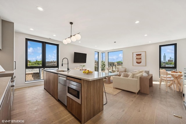 222 S Oakley Blvd Unit 3, Chicago, IL 60612 - kitchen with modern cabinets, dishwasher, open floor plan, light wood-type flooring, and recessed lighting