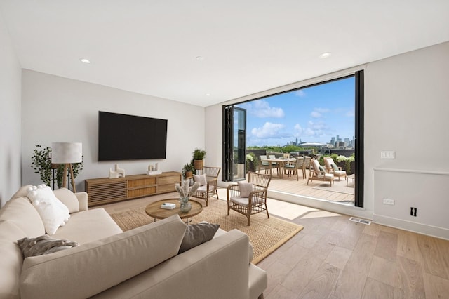 222 S Oakley Blvd Unit 3, Chicago, IL 60612 - living area featuring a wall of windows, light wood-style floors, and recessed lighting