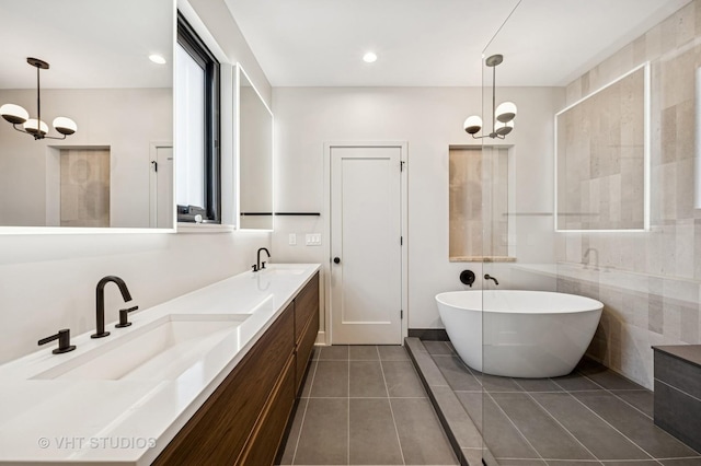 222 S Oakley Blvd Unit 3, Chicago, IL 60612 - full bath with tile patterned flooring, a soaking tub, double vanity, and recessed lighting