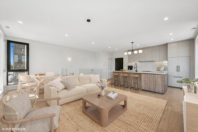 222 S Oakley Blvd Unit 3, Chicago, IL 60612 - living area with light wood-style flooring and recessed lighting