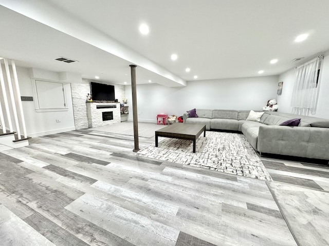 1211 Highland Dr, Prospect Heights, IL 60070 - living room featuring wood finished floors, recessed lighting, and a fireplace
