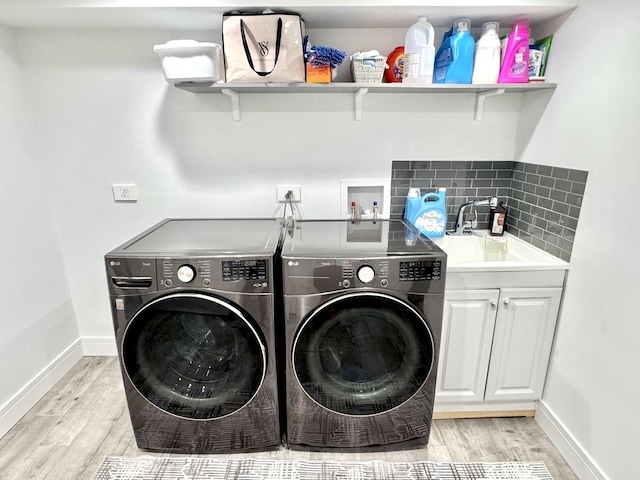 1211 Highland Dr, Prospect Heights, IL 60070 - laundry area with separate washer and dryer, light wood-type flooring, and cabinet space