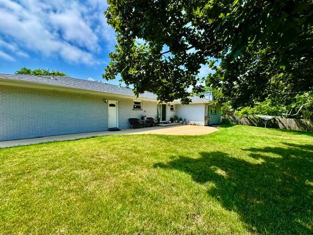 1211 Highland Dr, Prospect Heights, IL 60070 - rear view of property with a patio and a yard