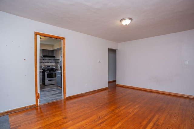 15533 Vincennes Rd, Phoenix, IL 60426 - spare room with wood finished floors and baseboards