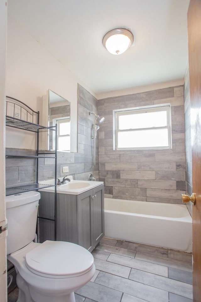 15533 Vincennes Rd, Phoenix, IL 60426 - full bath featuring vanity, shower / washtub combination, tile walls, and wood finished floors