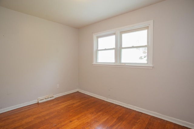 15533 Vincennes Rd, Phoenix, IL 60426 - empty room with baseboards and wood finished floors