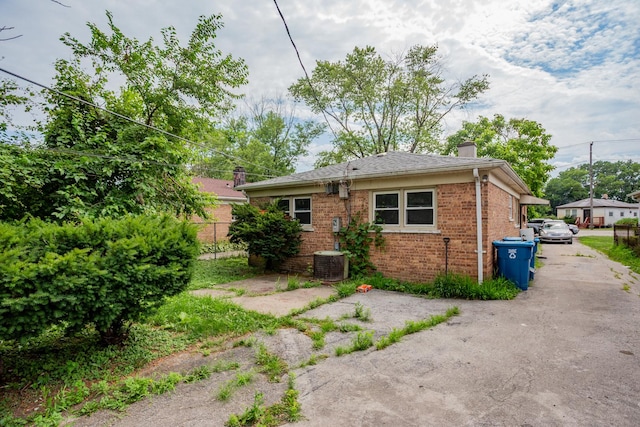 15533 Vincennes Rd, Phoenix, IL 60426 - back of property featuring a chimney and brick siding