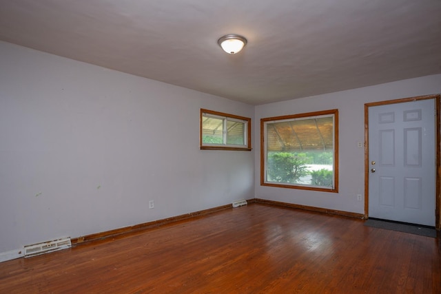 15533 Vincennes Rd, Phoenix, IL 60426 - empty room featuring baseboards and wood finished floors