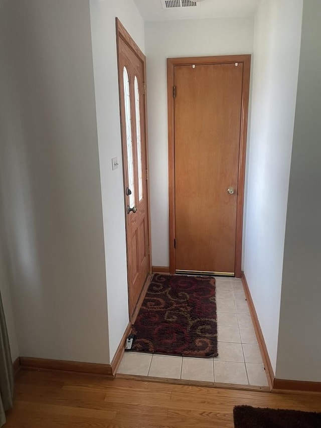 2940 N Nagle Ave, Chicago, IL 60634 - doorway to outside featuring light wood-style floors and baseboards