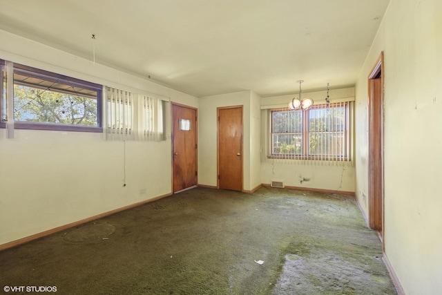 12358 S Lowe Ave, Chicago, IL 60628 - foyer entrance with a chandelier, plenty of natural light, and carpet flooring