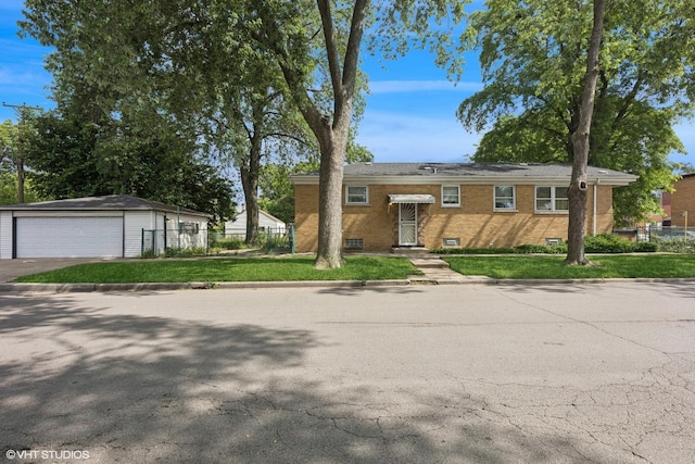 12358 S Lowe Ave, Chicago, IL 60628 - view of front of home featuring an outbuilding, brick siding, and a detached garage