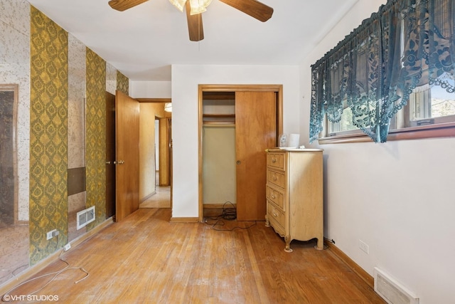 12358 S Lowe Ave, Chicago, IL 60628 - unfurnished bedroom featuring wood finished floors, a closet, and a ceiling fan