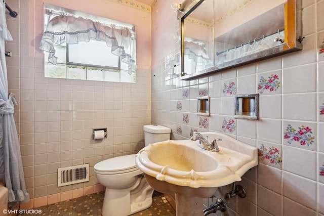 12358 S Lowe Ave, Chicago, IL 60628 - bathroom with tile walls and tile patterned flooring