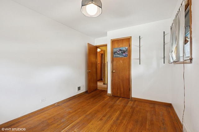 12358 S Lowe Ave, Chicago, IL 60628 - spare room featuring wood finished floors