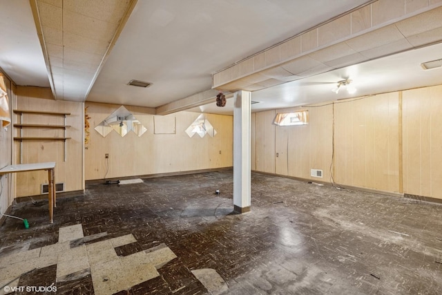 12358 S Lowe Ave, Chicago, IL 60628 - basement featuring tile patterned floors and wooden walls