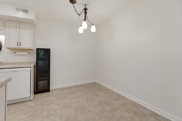 735 Wellington Ave, Elk Grove Village, IL 60007 - kitchen featuring dishwasher, light countertops, white cabinets, decorative light fixtures, and light flooring